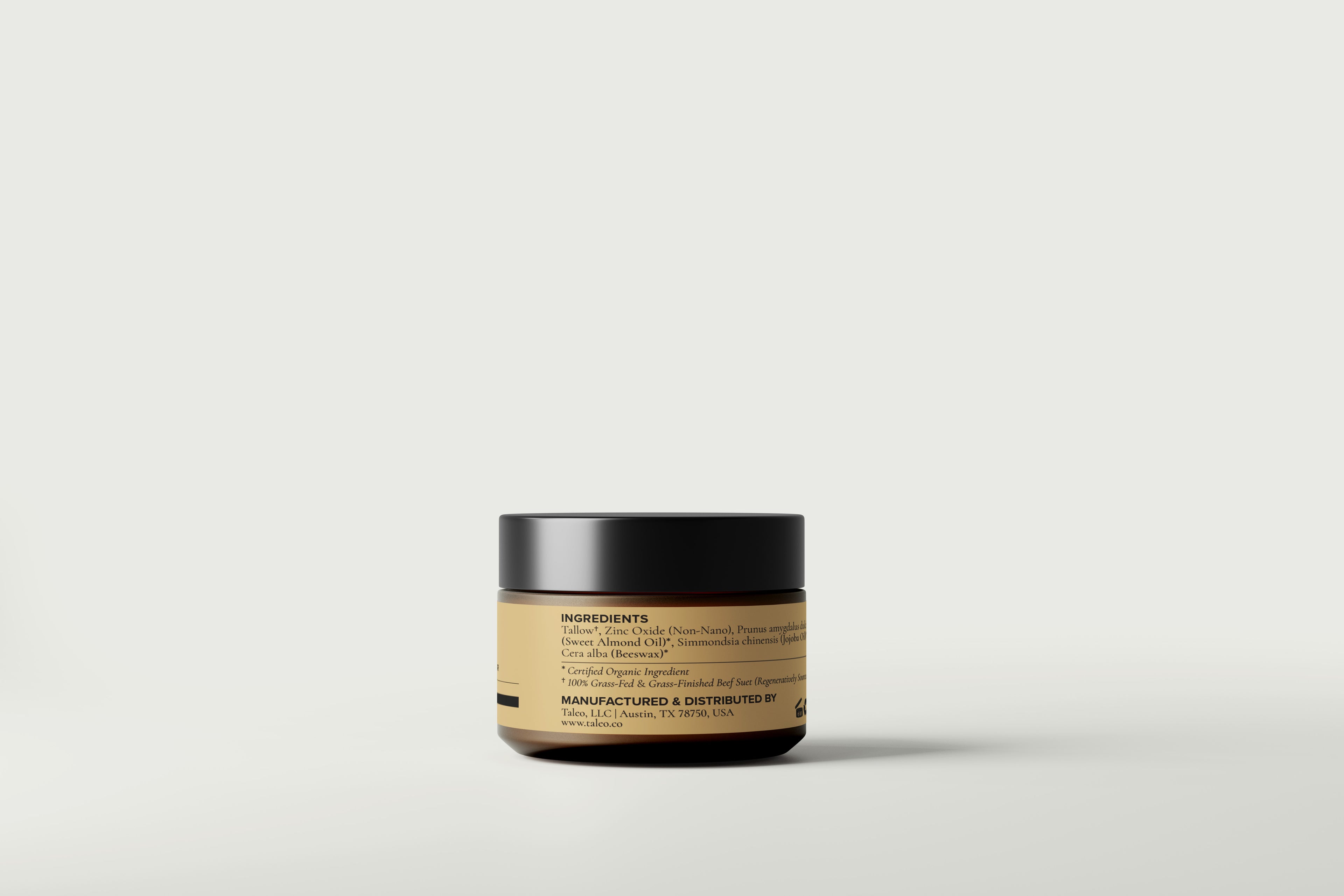 Back label of Taleo Sun Balm amber glass jar showing ingredients including tallow, non-nano zinc oxide, sweet almond oil, jojoba oil, and beeswax – manufactured by Taleo LLC, Austin TX